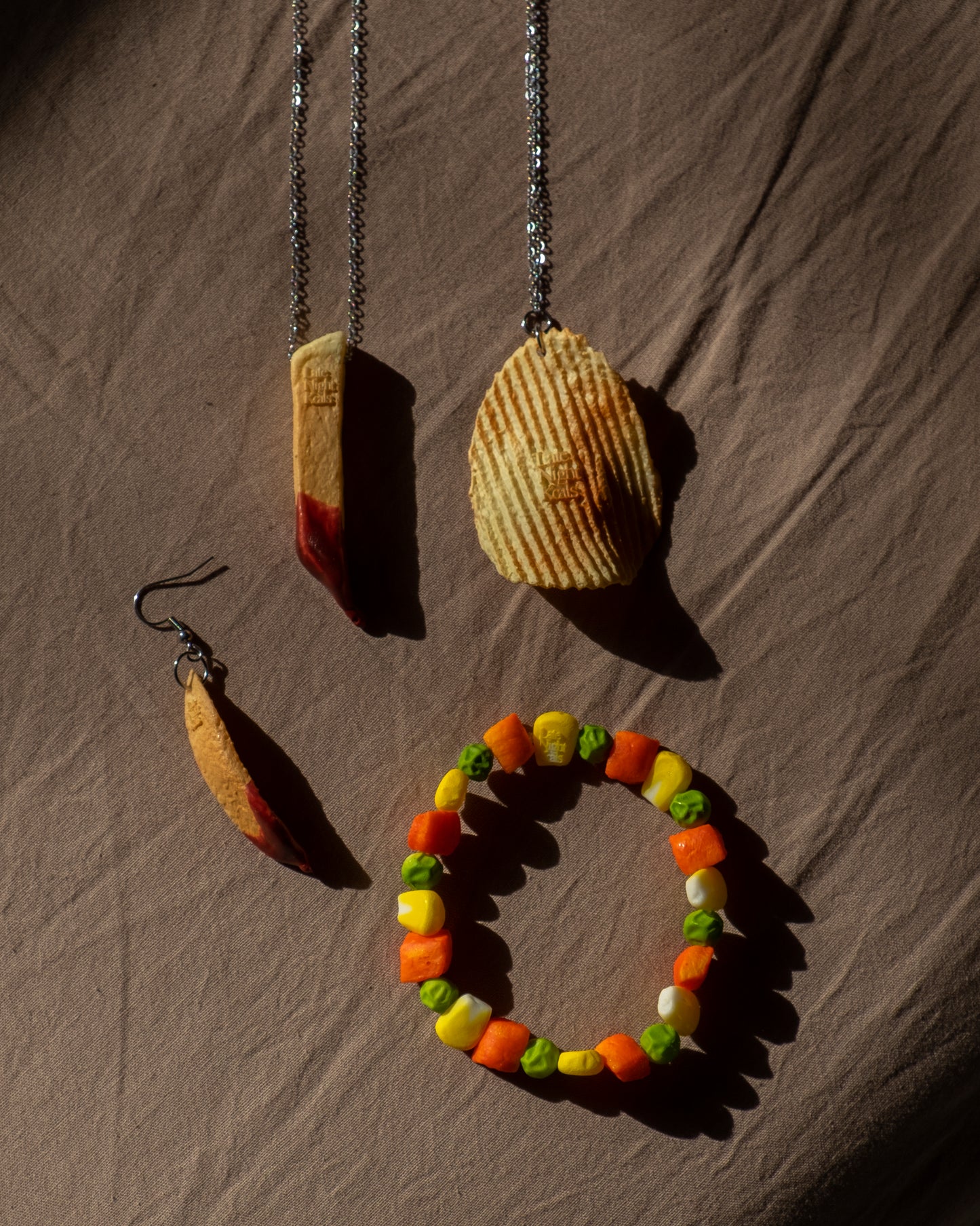 French fry dipped in ketchup earring